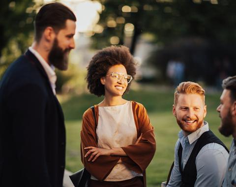 People standing around smiling