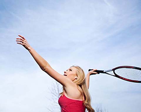 A woman playing tennis