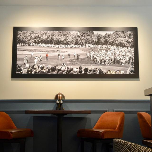 dinning area with framed golf championship image